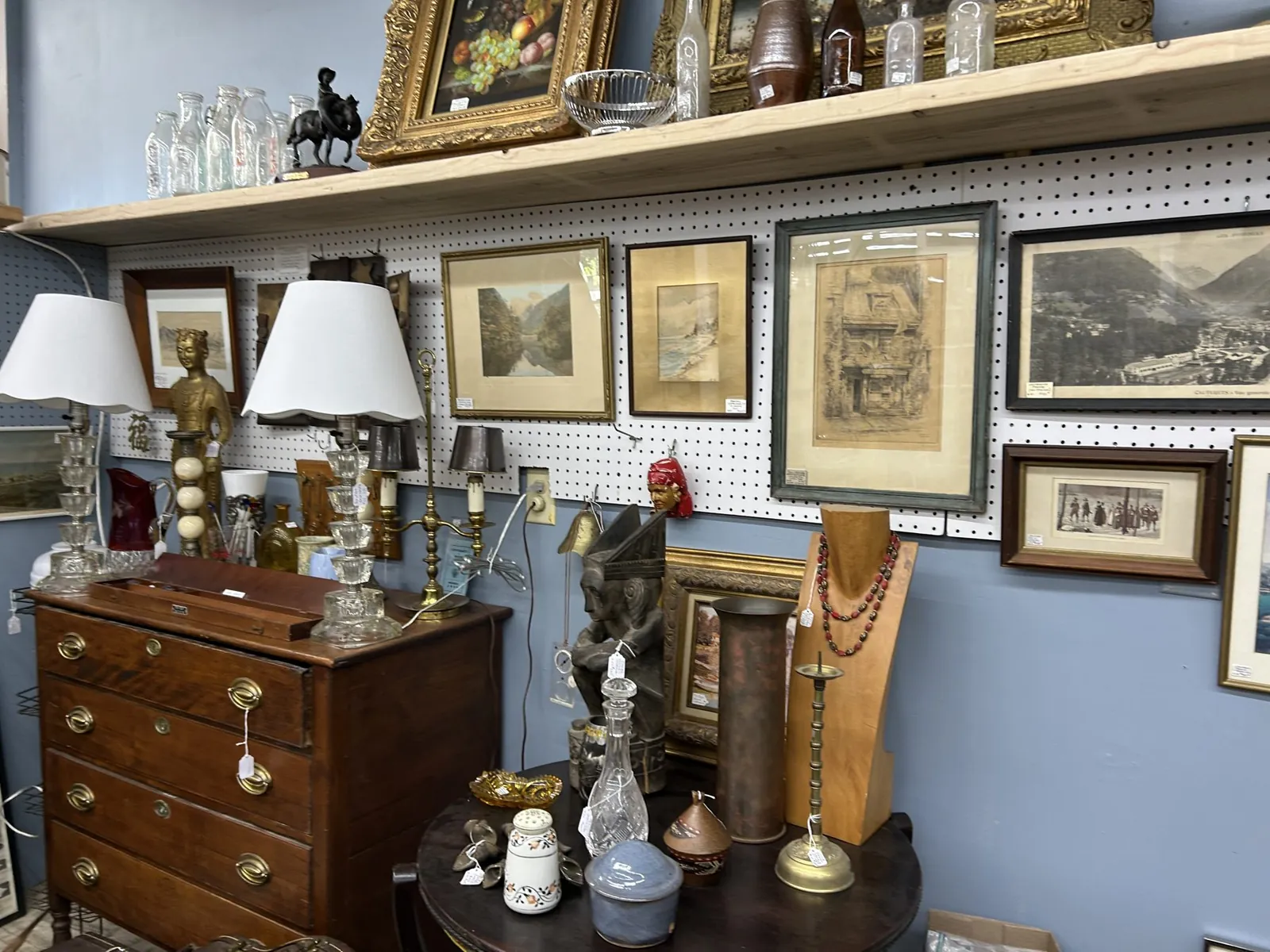 bangor-antiques-mall-wooden-chest-and-framed-art-display